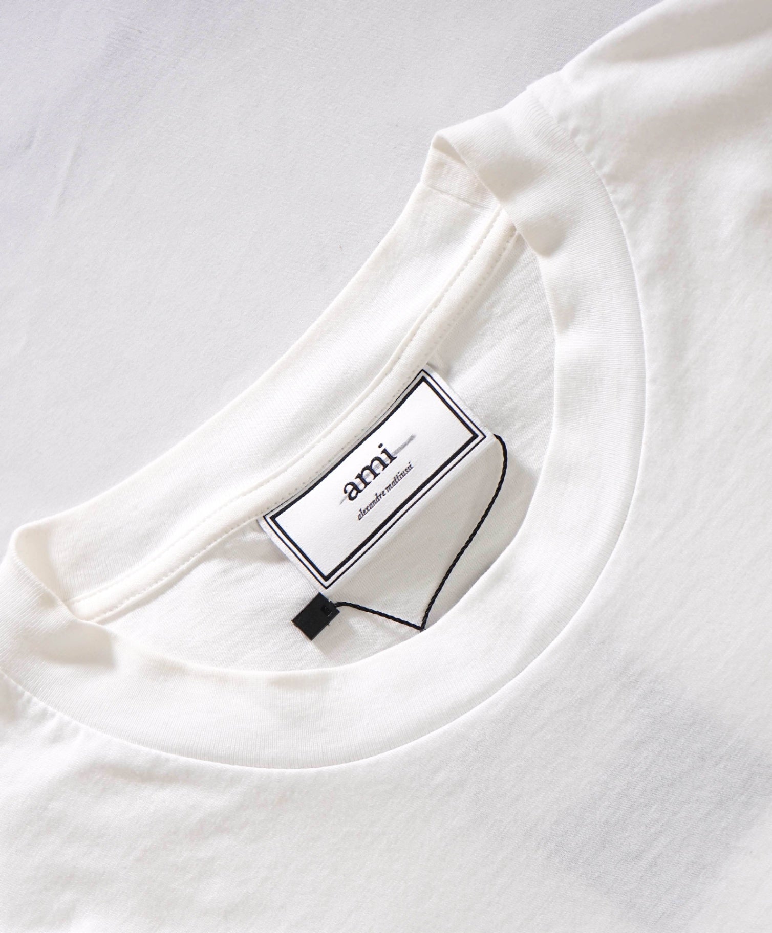 $130 AMI - Solid White Cotton Smiley T Shirt - L